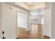 Bright living room featuring wood floors, white walls, an open floor plan, and modern finishes at 19700 N 76Th St # 2169, Scottsdale, AZ 85255