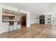 Open concept living area with wood floors and a fireplace offers comfortable and stylish living at 19700 N 76Th St # 2169, Scottsdale, AZ 85255