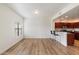 Bright living room features wood floors, a breakfast bar, and an open concept floor plan at 19700 N 76Th St # 2169, Scottsdale, AZ 85255