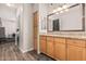 Bathroom with a walk-in closet, wood-look tile floors, and granite countertops at 19777 N 76Th St # 1131, Scottsdale, AZ 85255