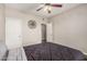 The bedroom includes a ceiling fan, and walk in closet. A large decor piece add visual interest at 19777 N 76Th St # 1131, Scottsdale, AZ 85255