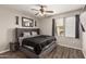 Comfortable bedroom with a ceiling fan, a window and wood-look floors for a modern style at 19777 N 76Th St # 1131, Scottsdale, AZ 85255