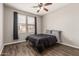 This bedroom has modern wood floors, neutral walls, and a window for natural light at 19777 N 76Th St # 1131, Scottsdale, AZ 85255