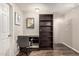 Office features wood-look floors, desk nook, and ample storage shelves at 19777 N 76Th St # 1131, Scottsdale, AZ 85255