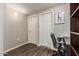 Office features wood-look floors, desk nook, and ample storage shelves at 19777 N 76Th St # 1131, Scottsdale, AZ 85255