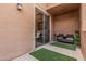 Patio features seating, turf, and a glass door at 19777 N 76Th St # 1131, Scottsdale, AZ 85255