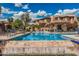 Sparkling pool with crystal clear water surrounded by plenty of lounge chairs and beautiful desert landscaping at 19777 N 76Th St # 1131, Scottsdale, AZ 85255