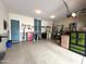 Spacious garage with epoxy flooring and ample storage, perfect for projects at 20525 W Hamilton St, Buckeye, AZ 85396
