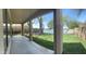 An outdoor patio providing a comfortable place to relax while offering picturesque views of the lake and backyard at 2074 N 109Th N Ave, Avondale, AZ 85392