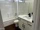 This bathroom features a shower-tub combo, vanity with storage, and modern fixtures at 2074 N 109Th N Ave, Avondale, AZ 85392