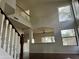 Bright living room with hardwood floors, tall ceilings and large windows that let in plenty of natural light at 2074 N 109Th N Ave, Avondale, AZ 85392