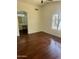 Spacious main bedroom with dark hardwood floors, neutral walls, and a lake view at 2074 N 109Th N Ave, Avondale, AZ 85392