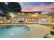 Stunning backyard pool with patio, covered seating, and a beautiful two-story home at sunset at 2106 E La Vieve Ln, Tempe, AZ 85284