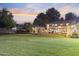 Well-manicured backyard with a large lawn, patio, and outdoor dining area, perfect for summer evenings at 2106 E La Vieve Ln, Tempe, AZ 85284