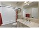 Bathroom featuring white subway tile, shower-tub, and vanity with stone countertop at 2106 E La Vieve Ln, Tempe, AZ 85284