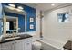 Bathroom with a dark countertop, framed art, and tile shower with glass door at 2106 E La Vieve Ln, Tempe, AZ 85284