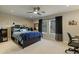 Neutral bedroom with fan, a bed with storage, and a double window at 2106 E La Vieve Ln, Tempe, AZ 85284