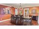Formal dining room with hardwood floors, elegant chandelier, and large painting on the wall at 2106 E La Vieve Ln, Tempe, AZ 85284