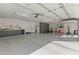Spacious garage with work bench, storage cabinets, and room for gym equipment at 2106 E La Vieve Ln, Tempe, AZ 85284