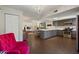 Open kitchen and dining area with stainless steel appliances, gray cabinets, and modern lighting at 2106 E La Vieve Ln, Tempe, AZ 85284