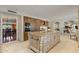 Bright kitchen featuring a large island, stainless steel appliances, and custom cabinetry for a luxurious cooking experience at 2106 E La Vieve Ln, Tempe, AZ 85284
