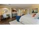 Luxurious main bedroom featuring a seating area, stylish decor, wood floors, and ample natural light for a serene space at 2106 E La Vieve Ln, Tempe, AZ 85284