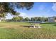 A park with a tennis court in the background and a picnic table in the foreground at 2106 E La Vieve Ln, Tempe, AZ 85284