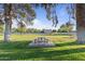 Green park featuring tennis courts, picnic tables, and mature shade trees on a sunny day at 2106 E La Vieve Ln, Tempe, AZ 85284
