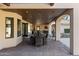 Spacious covered patio with an outdoor dining table and seating area at 2106 E La Vieve Ln, Tempe, AZ 85284