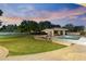 Backyard pool area with a gazebo, patio seating, and beautifully landscaped surroundings at 2106 E La Vieve Ln, Tempe, AZ 85284