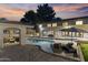 Inviting backyard pool area with lounge seating and covered patio for relaxation and entertaining at 2106 E La Vieve Ln, Tempe, AZ 85284