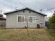 Rear view of the home featuring a spacious backyard with a clothesline at 2141 W Elm St, Phoenix, AZ 85015