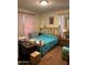 Comfortable bedroom with natural light and a brass bed frame at 2141 W Elm St, Phoenix, AZ 85015