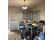 Dining room featuring neutral walls and a window with patterned curtains at 2141 W Elm St, Phoenix, AZ 85015