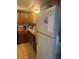 Traditional kitchen with wood cabinets and white appliances at 2141 W Elm St, Phoenix, AZ 85015