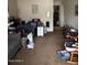 Cozy living room with comfortable seating and carpet flooring at 2141 W Elm St, Phoenix, AZ 85015