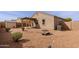 Low maintenance backyard featuring desert landscaping, covered patio, and block wall at 2220 N St Bonita Ln, Casa Grande, AZ 85122