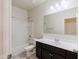 Bathroom with a shower-tub combo and a vanity with a dark cabinet at 2220 N St Bonita Ln, Casa Grande, AZ 85122