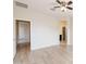 Spacious bedroom features luxury vinyl plank flooring and two entryways to the bathroom at 2220 N St Bonita Ln, Casa Grande, AZ 85122