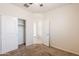 Neutral bedroom featuring a ceiling fan and closet with sliding doors at 2220 N St Bonita Ln, Casa Grande, AZ 85122