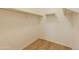 Walk-in closet featuring hardwood floors and metal shelving at 2220 N St Bonita Ln, Casa Grande, AZ 85122