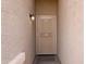 Inviting front entrance with a security screen door and exterior lighting at 2220 N St Bonita Ln, Casa Grande, AZ 85122
