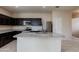 Modern kitchen featuring stainless steel appliances, granite countertops, and a central island at 2220 N St Bonita Ln, Casa Grande, AZ 85122