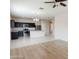 Open-concept kitchen with stainless appliances, granite counters, and an adjacent living space at 2220 N St Bonita Ln, Casa Grande, AZ 85122