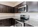 Close-up of the stainless steel appliances and granite countertops at 2220 N St Bonita Ln, Casa Grande, AZ 85122