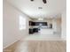 Modern eat-in kitchen features stainless steel appliances, granite countertops and black cabinets at 2220 N St Bonita Ln, Casa Grande, AZ 85122