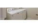 Well-lit laundry room featuring a new Maytag washing machine and dryer at 2220 N St Bonita Ln, Casa Grande, AZ 85122