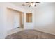 Open-concept living area boasts neutral walls and carpeted flooring at 2220 N St Bonita Ln, Casa Grande, AZ 85122