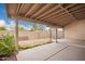 Covered back patio with a view of the gravel-covered yard, and a block wall fence at 2309 W Shawnee Dr, Chandler, AZ 85224