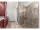 A bathroom featuring granite countertops and a modern tiled shower at 2309 W Shawnee Dr, Chandler, AZ 85224